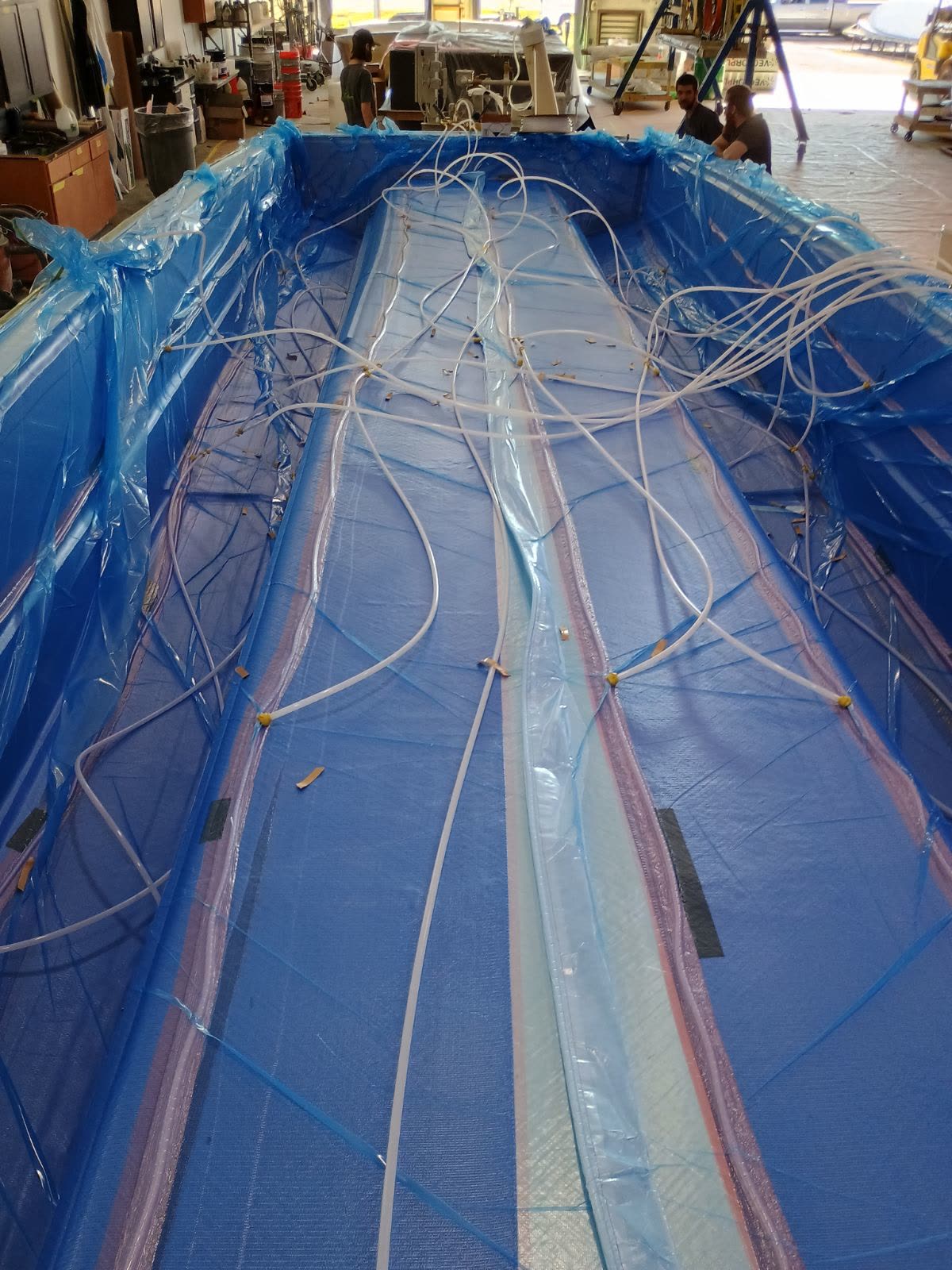 Carbon fiber hull under vacuum bag during infusion