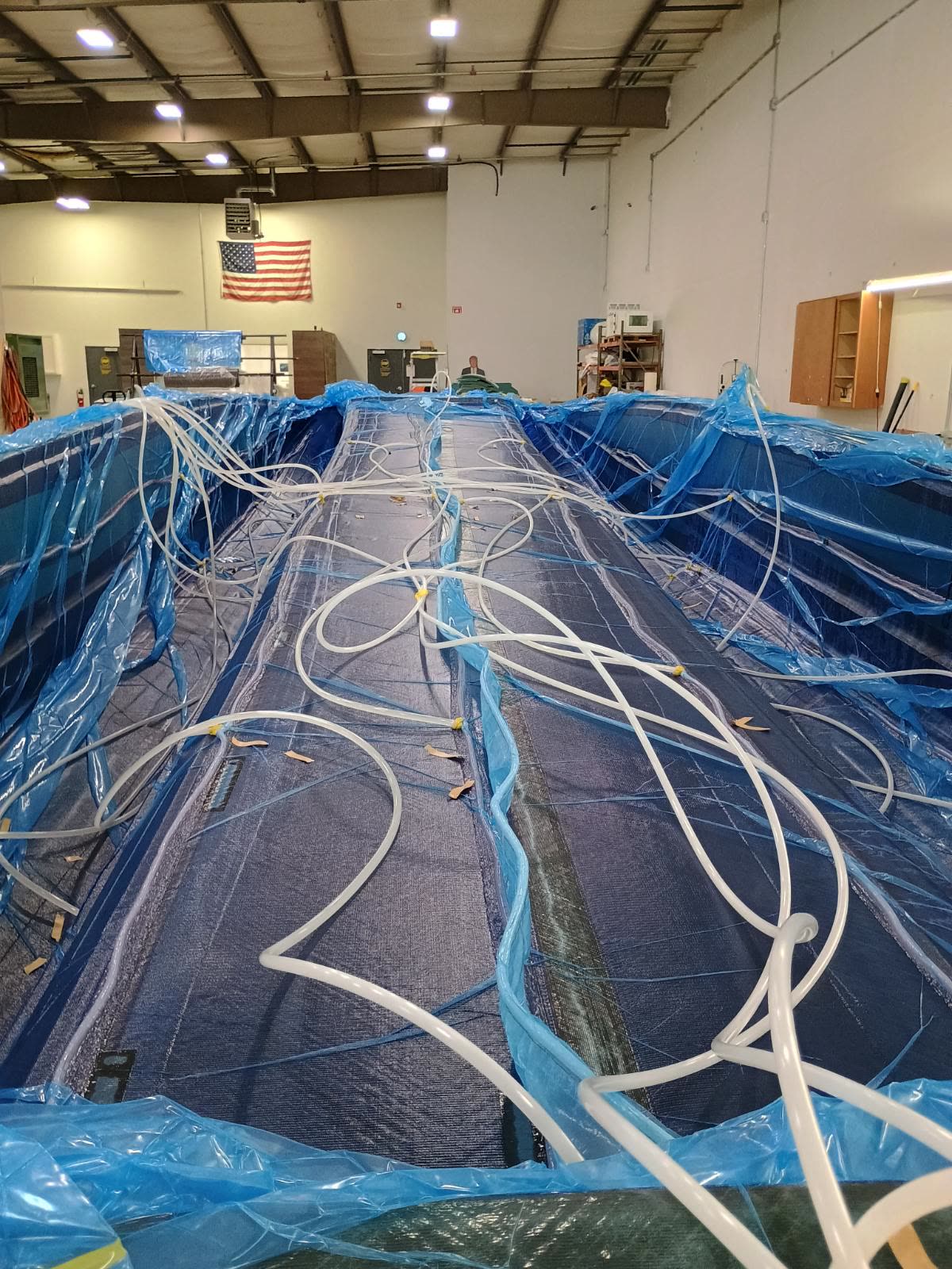 American craftsmen vacuum-infusing a carbon fiber Platinum hull in the USA